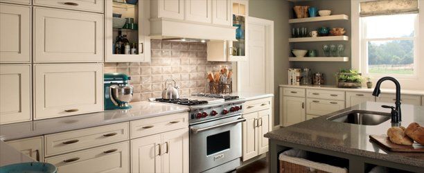 Refaced kitchen cabinetry with new solid wood doors and drawer fronts